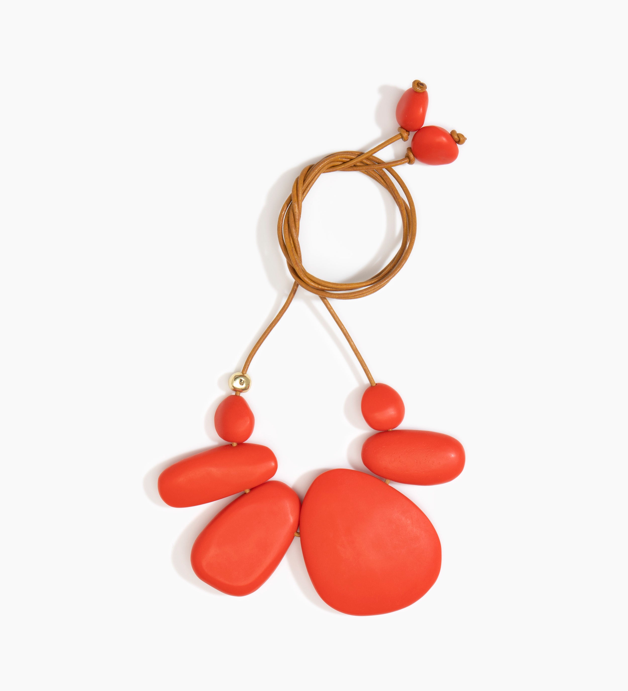 Dinosaur Designs Riverstone Choker Necklaces in Coral Pop color resin with Brass Bead on Tan Leather Material