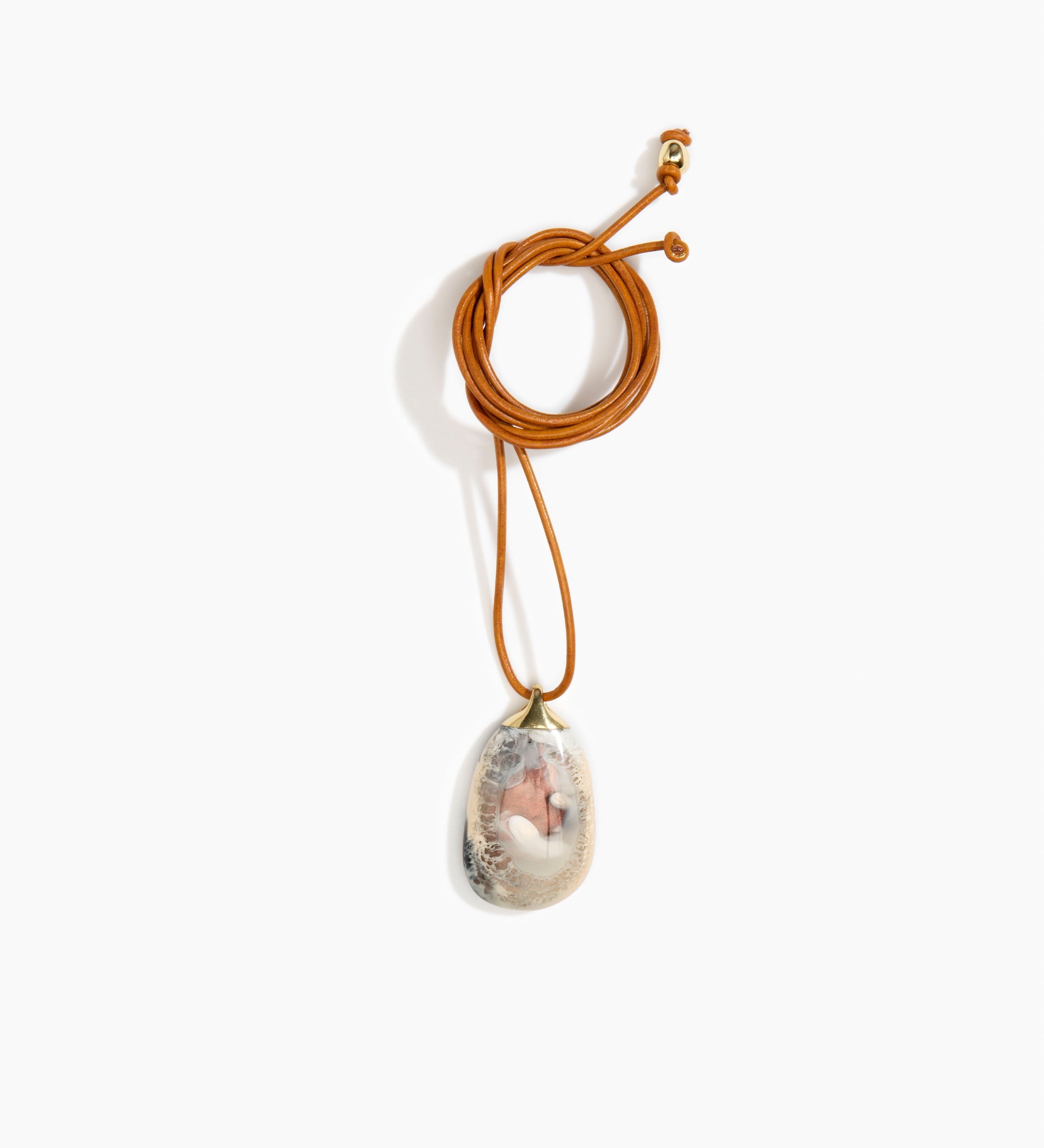 Dinosaur Designs River Rock Pendant on Leather Necklaces in Sandy Pearl color resin 