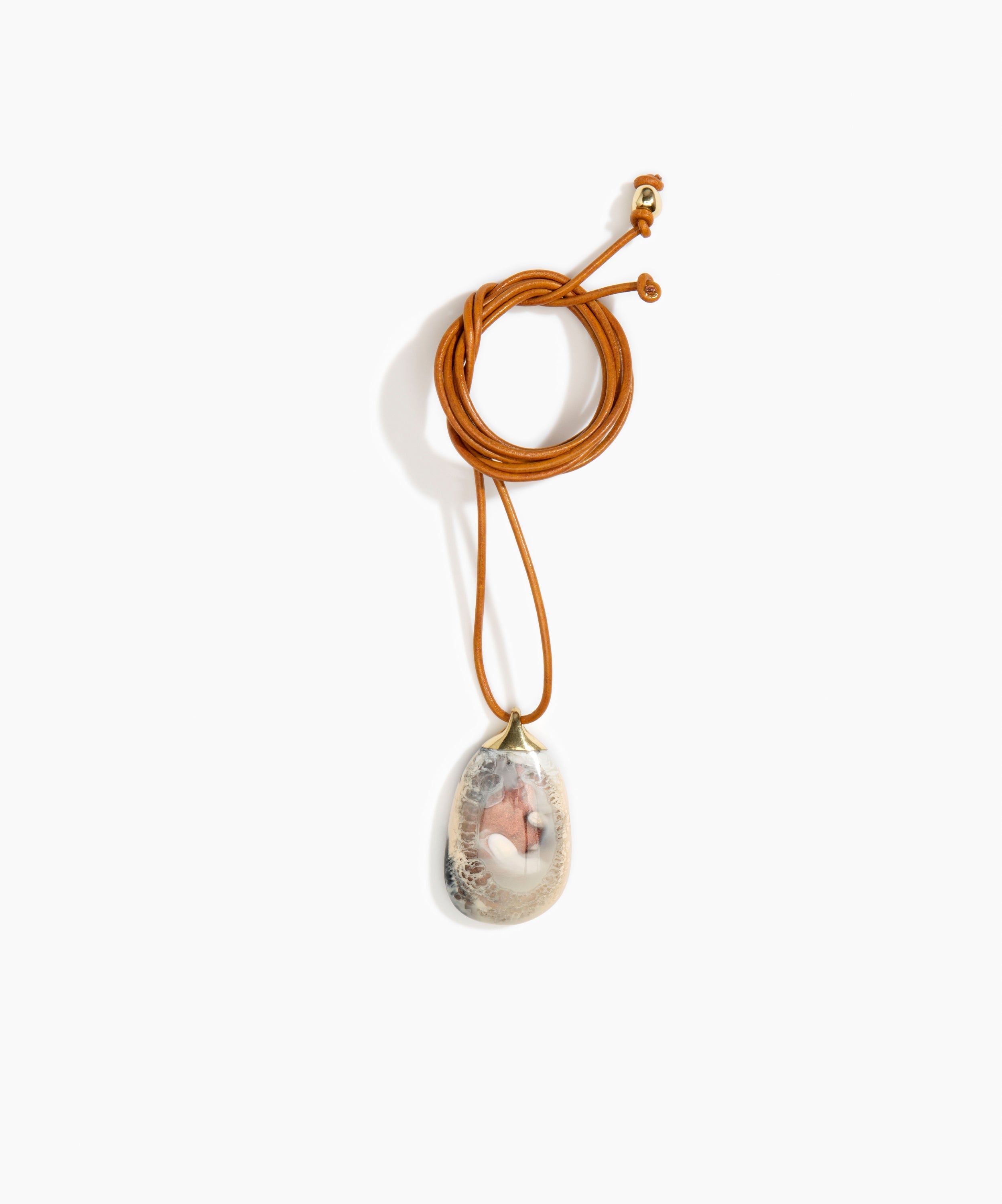 Dinosaur Designs River Rock Pendant on Leather Necklaces in Sandy Pearl color resin 