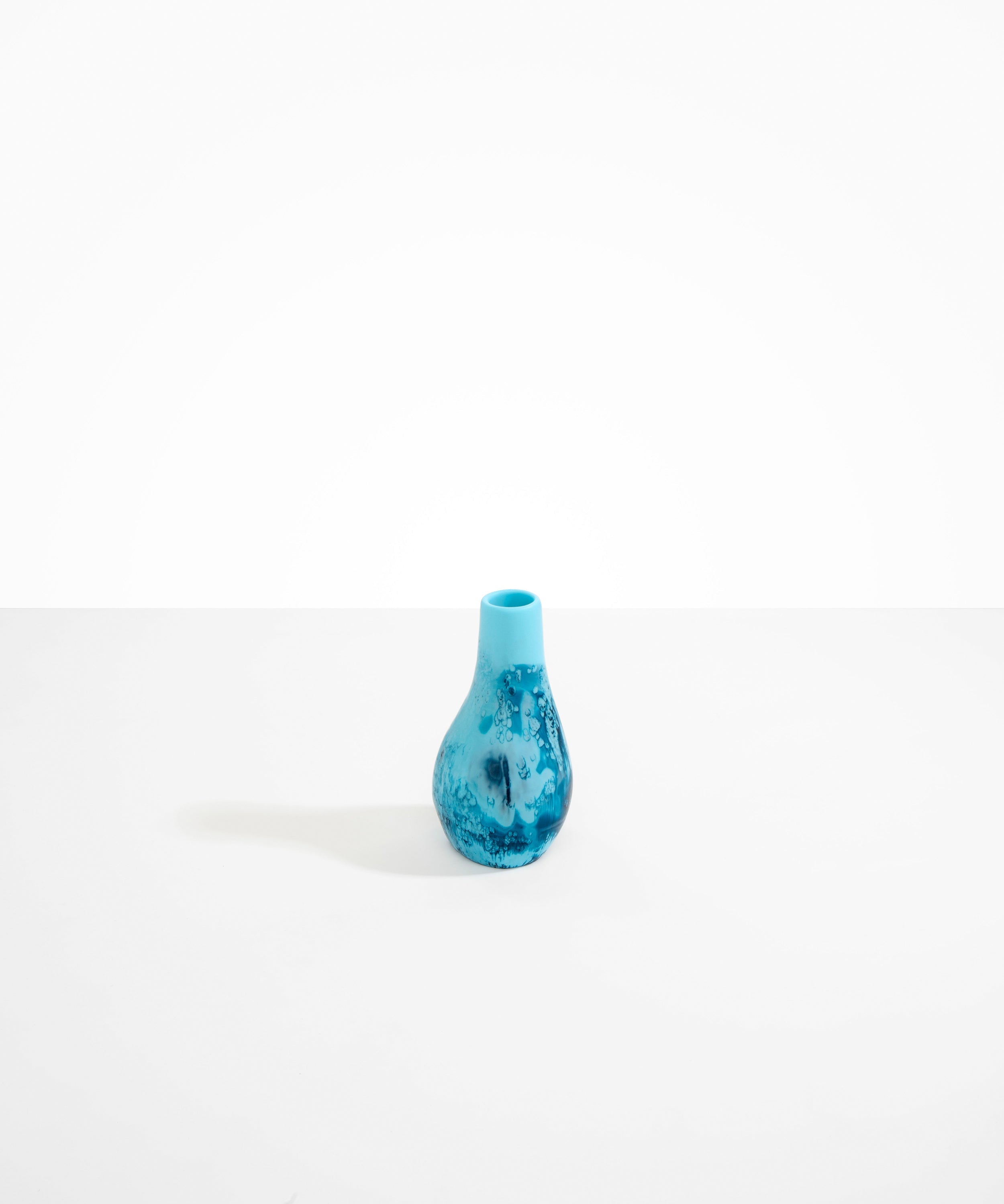 Dinosaur Designs medium sized Liquid vase in water blue color resin