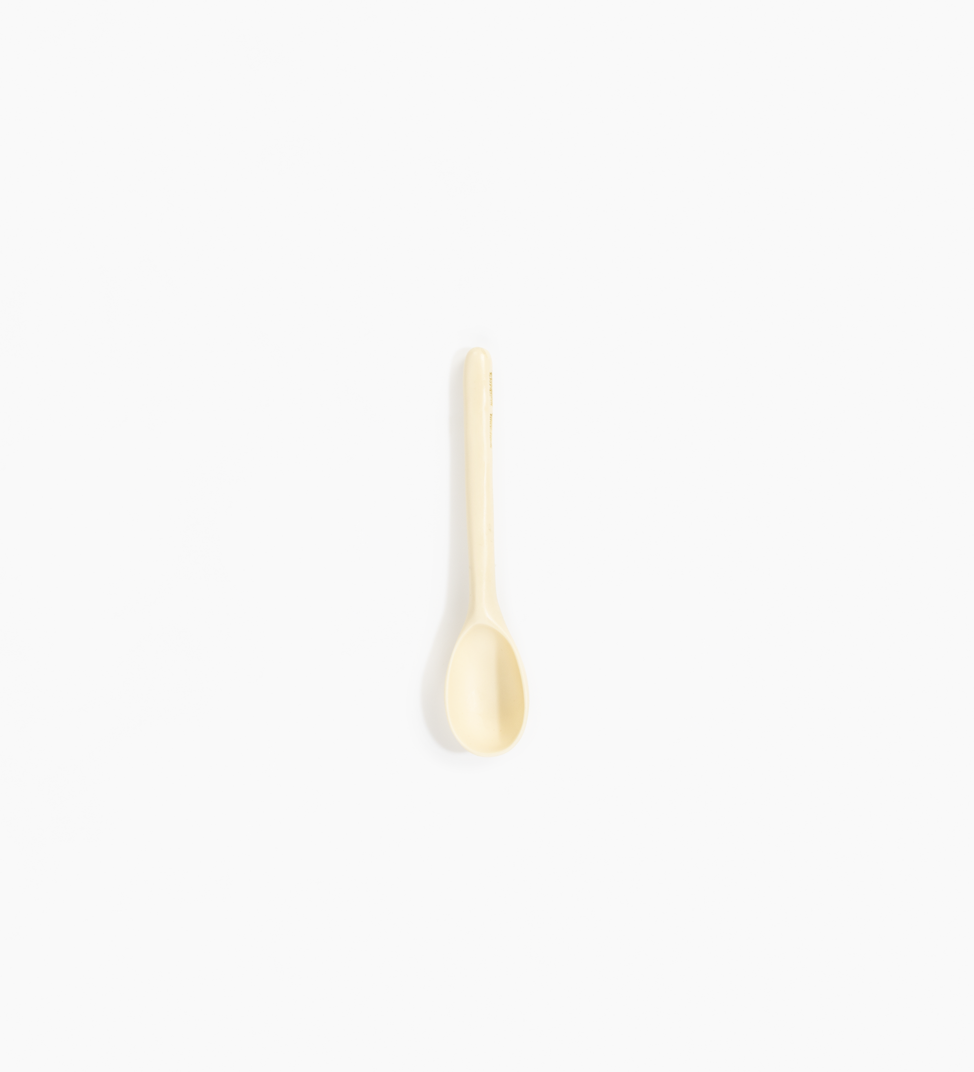 Dinosaur Designs Stone Spoon Tableware in Cream color resin