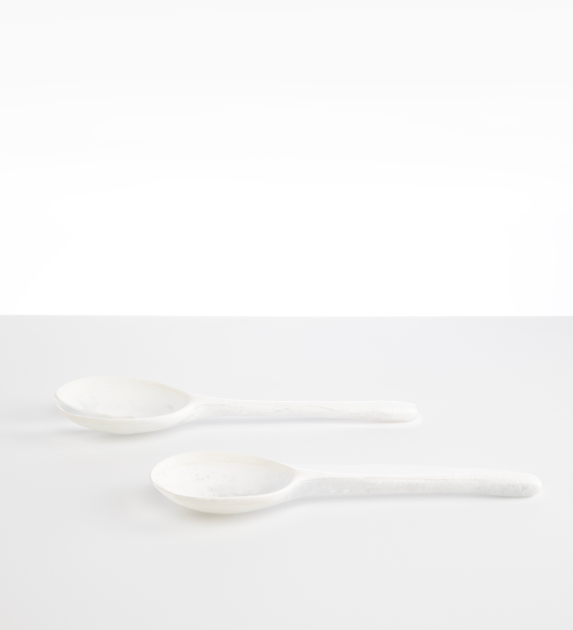 Dinosaur Designs Long Stone Servers Tableware in Snow Swirl color resin